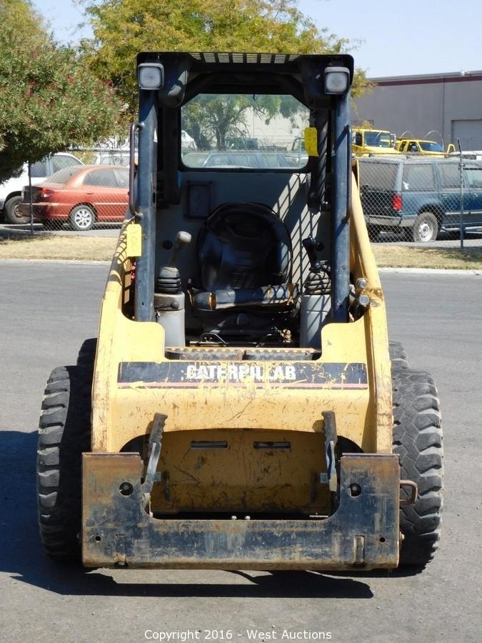 West Auctions Auction CAT Skid Steer, Genie Boom Lift and Skid Steer