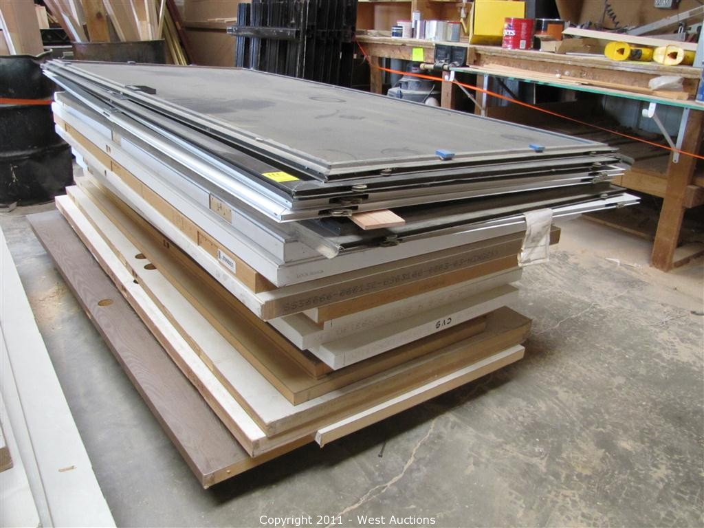 West Auctions Auction Door and Trim Shop in Newcastle, California ITEM Stack of (14) Doors
