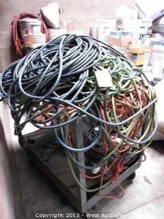 Metal Rolling Cart with Multiple Extension Cords and Air Hoses