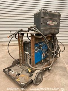 Miller XMT 304 Series DC Inverter Arc Welder with Suitcase Xtreme 12VS Wire Feeder and Cart