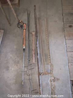 Assorted Metal Poles, Disk Axles, And Other Contents Of Metal Bin
