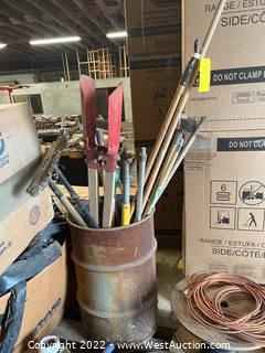 Steel Barrel And Contents: Assorted Broom Handles And Tools