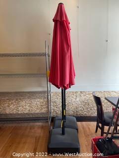 Red Outdoor Umbrella With Weighted Stand And Wheels