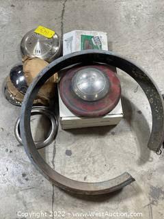 Assorted Car Parts: Hubcaps, Brake Shoes And More
