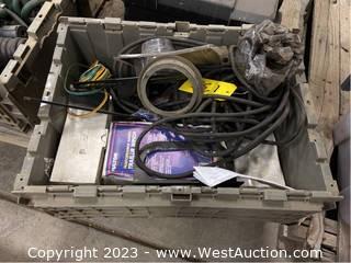 Contents of Tote: Assorted Brake Lights, Wire Cables, and Trailer Winch