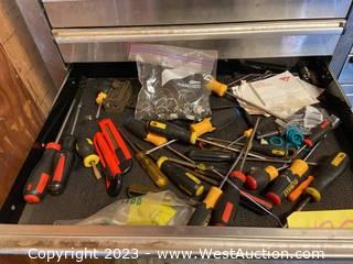 Contents of Drawer: Assorted Screwdrivers, Flatheads, Pipe Straps, and Box cutters 
