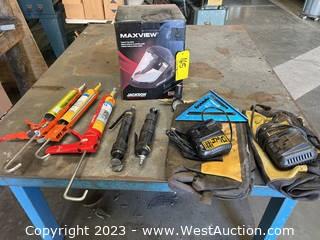 Contents Of Table: Assorted Hand Tools, Sealant, DeWalt Chargers, Mask, And More