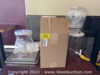 Contents Of Table: (4) Assorted Liquid Dispensers, (4) Aluminum Baking Trays, Baking Sheets, And More