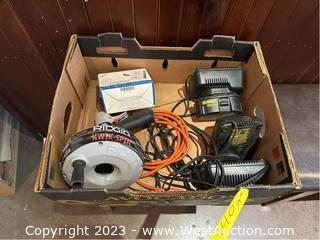 AC Adapter, (4) Assorted Battery Chargers, (2) Extension Cords, And Ridgid Kwik-Spin 