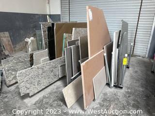  Approximately (49) Assorted Partial Granite Slabs with Slab Rack